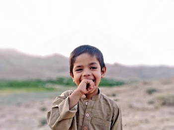 Photo of Boy Biting His Right Hand