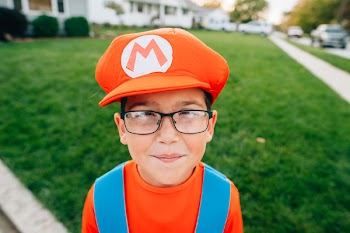 Photo of Boy in Super Mario Costume Smiling
