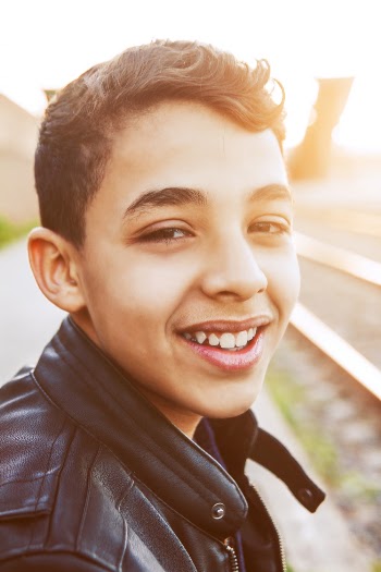Photo of Boy Wearing Black Leather Jacket