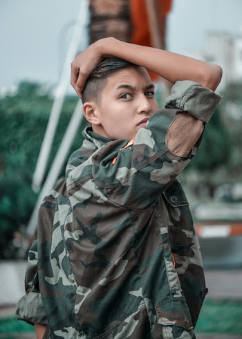 Photo of Boy Wearing Camouflage Jacket