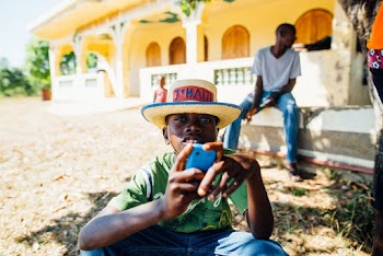 Photo of Boy Wearing Straw Hat