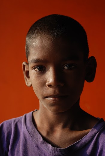 Photo of Boy With Red Background