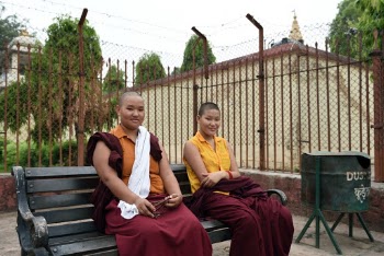 Photo of Boys Sitting on Wooden Bench