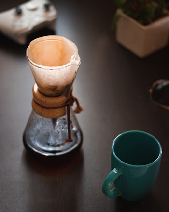 Photo of Brewed Coffee Near Empty Mug