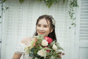 Photo Of Bride Holding Bouquet