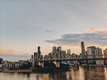Photo of Bridge and Buildings During Golden Hour