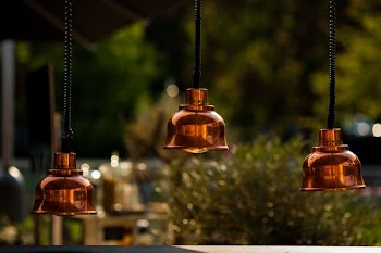 photo of brown 3-bulb pendant lamps