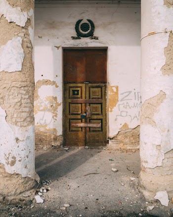 Photo of Brown and Black Wooden Door