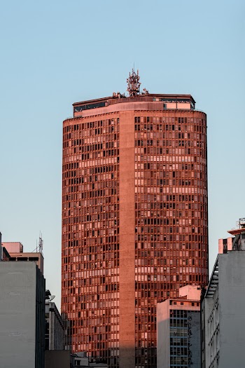 Photo of Brown High-rise Building Under Clear Sky