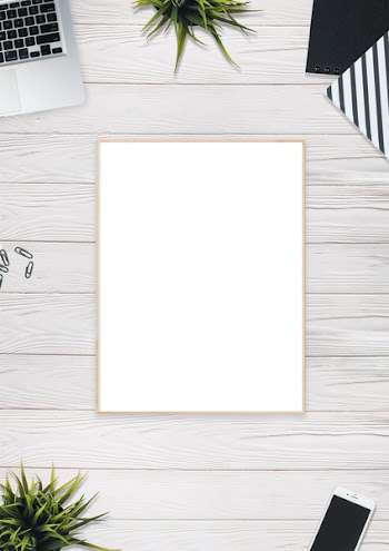 Photo of Brown Photo Frame Near Laptop