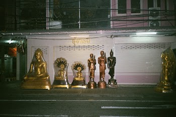 Photo of Buddha Statues on Sidewalk
