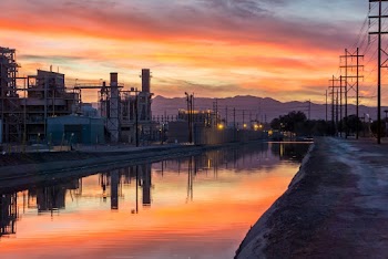 Photo of Building Near Body of Water during Golden Hour
