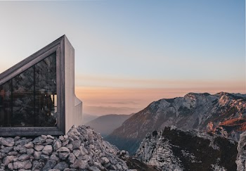 Photo Of Building On Top Of Rock 