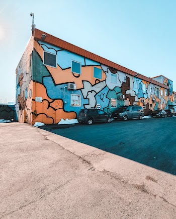 Photo of Building With Multicolored Graffiti
