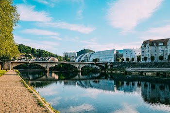Photo of Buildings Near River Under Blue Sky