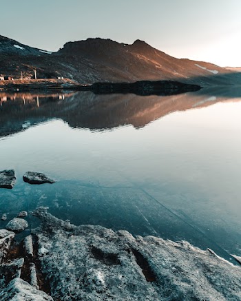 Photo of Calm Waters Across the Mountain