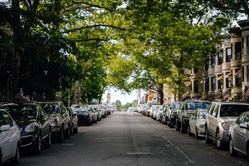 Photo of Cars Parked Along Roadside