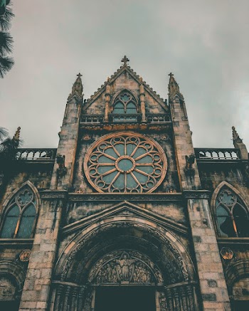 Photo Of Cathedral Under Cloudy Sky