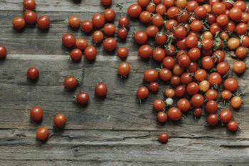 Photo of Cherry Tomatoes on Wooden Surface