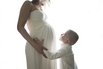 Photo Of Child Holding Mother's Womb