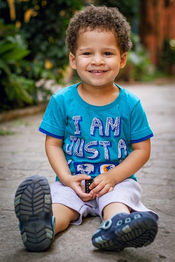 Photo Of Child Sitting On Floor