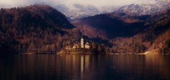 Photo of Church Near Lake and Mountain