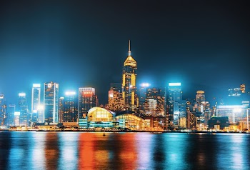 Photo of City Buildings During Night