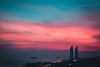 Photo Of City During Dawn