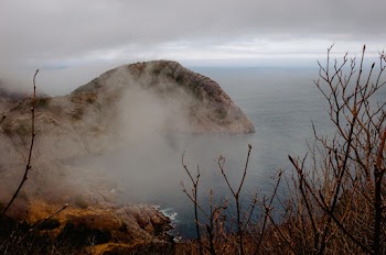 Photo of Cliff Near the Sea Under Cloudy Sky