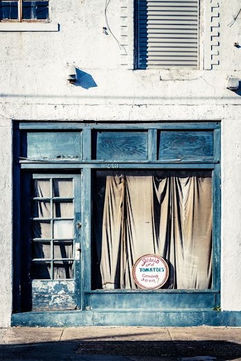 photo of closed store with black door