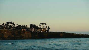 Photo Of Coastline During Dawn 