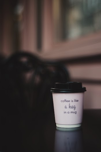 Photo of Coffee Cup on Wooden Surface