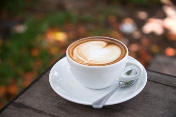 Photo of Coffee Latte on Wooden Table Top