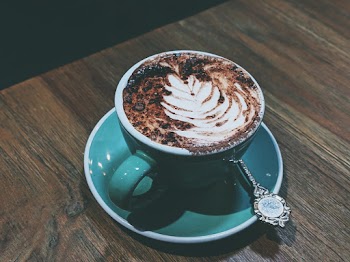 Photo Of Coffee On Wooden Table