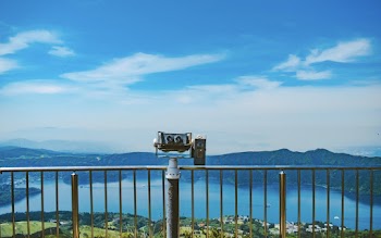 Photo of Coin Operated Binoculars Near Railings