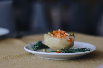Photo of Cooked Green peas,Carrots and Rosemary leaves on a White Plate
