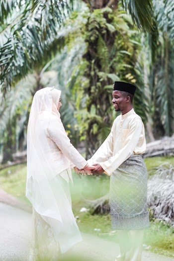 Photo Of Couple Holding Hands