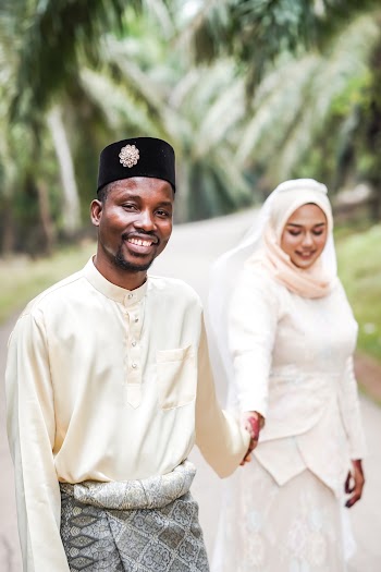 Photo Of Couple Holding Hands