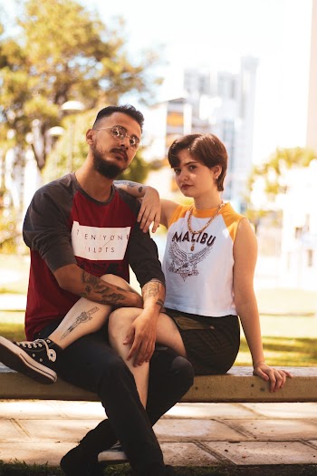 Photo of Couple Sitting on Bench