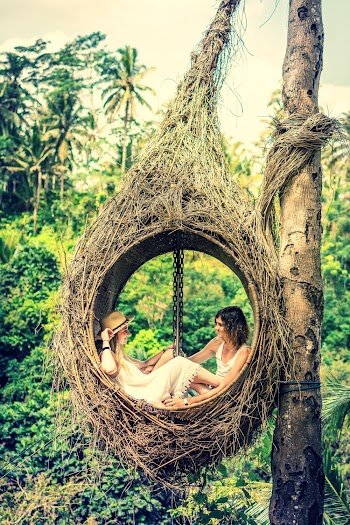 Photo of Couple Sitting on Hammock