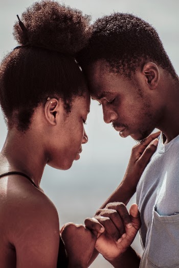 Photo of Couple Standing Close to Each Other
