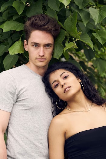 Photo of Couple Standing Near Green Leaves