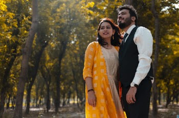Photo of Couple Standing Near Trees