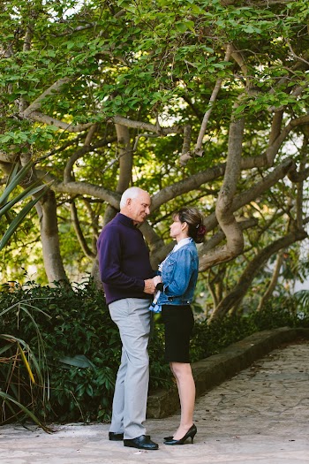 Photo of Couple Standing Together While Holding Hands