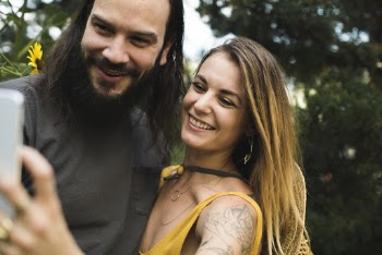 Photo of Couple Taking a Selfie