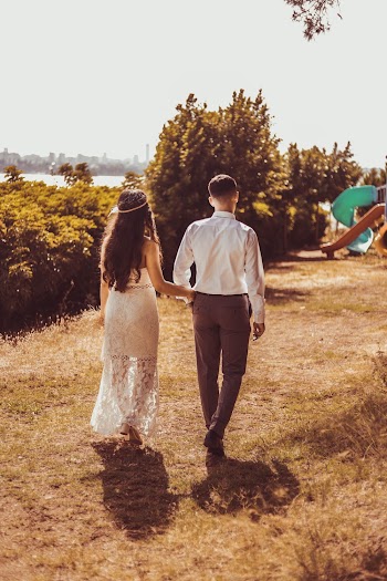 Photo of Couple Walking on Grass