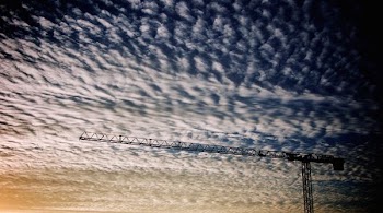 photo of crane and white clouds