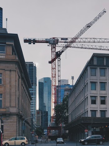 Photo of Crane Near Buildings
