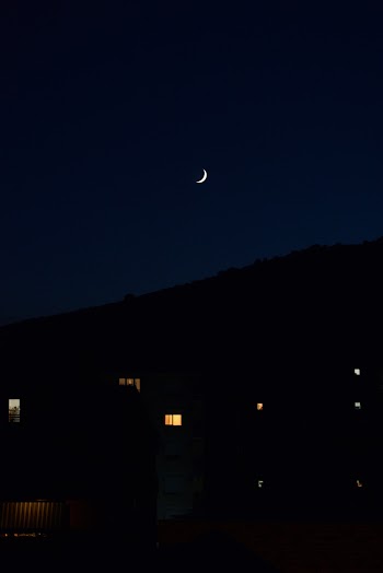 Photo of Crescent Moon During Nighttime