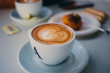 photo of cup of coffee latte with ark